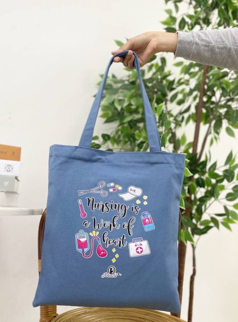 TOTE BAG NURSING IS A WORK OF HEART - LIGHT BLUE